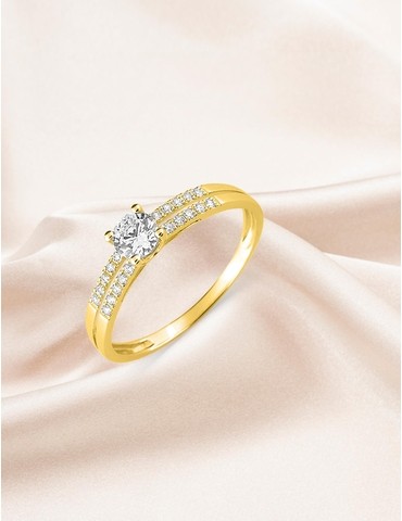 Bague solitaire accompagné...