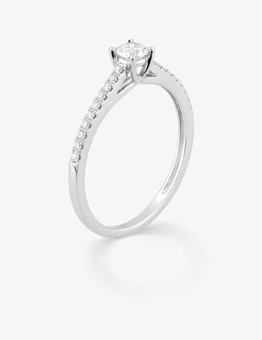 Bague solitaire accompagné...